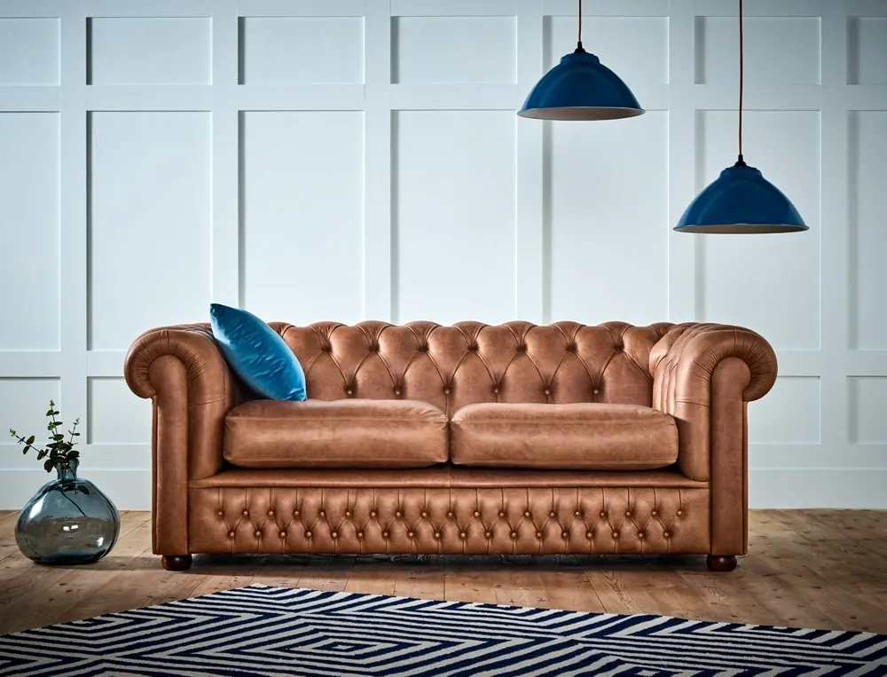 Sillón Chesterfield tapizado en cuero suela
